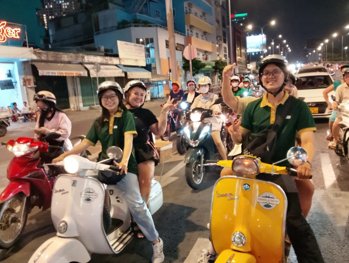 Saigon Night Street Food Tour by Vintage Vespa