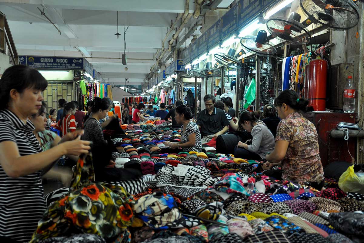 Hanoi silk fabrics and tailoring shops inside Dong Xuan Market Vietnam