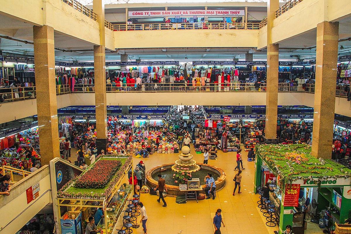 Inside Dong Xuan Market Hanoi traditional traders and local shopping stalls